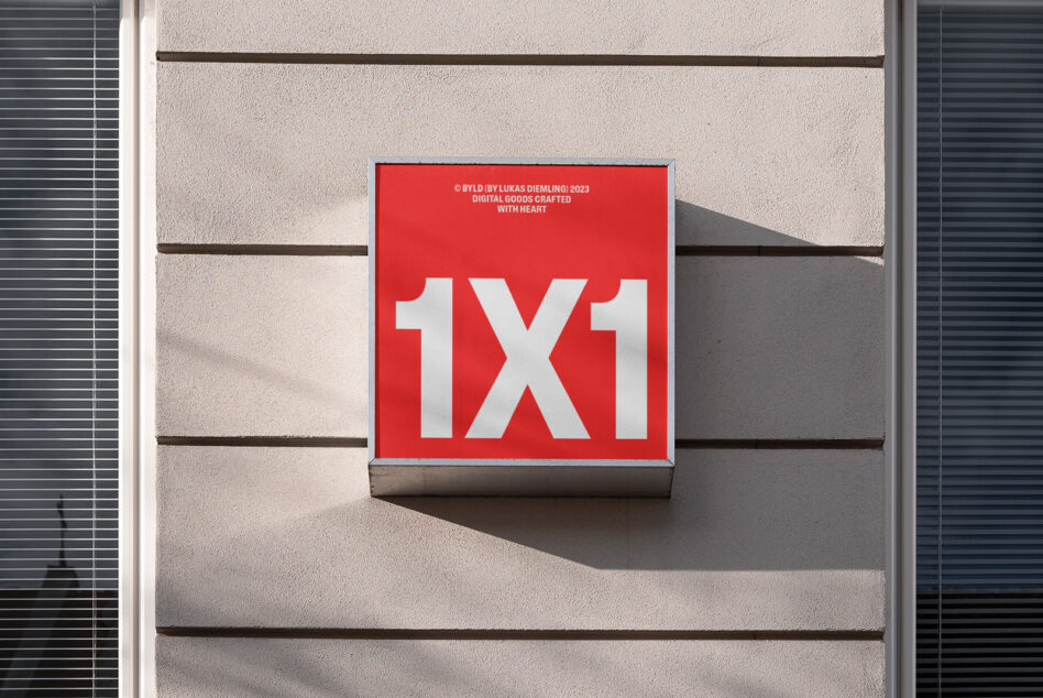 Red sign with bold white typography 1X1, on building facade, perfect for mockup graphics and font display.