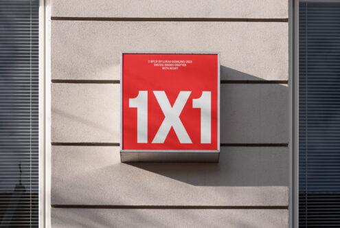 Red square sign with bold white '1X1' text, modern font, shadows on building facade, suitable for graphic mockups and font display.