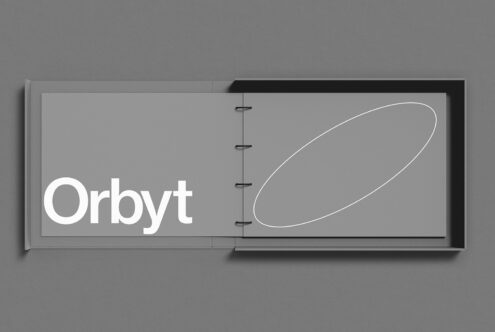 Open book mockup with modern branding on grey background, detail showcasing font and graphic design, perfect for presentations and portfolios.