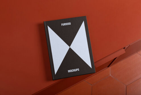 Book cover mockup on orange background, sleek design presentation, modern graphic print showcase, realistic texture, portfolio display.