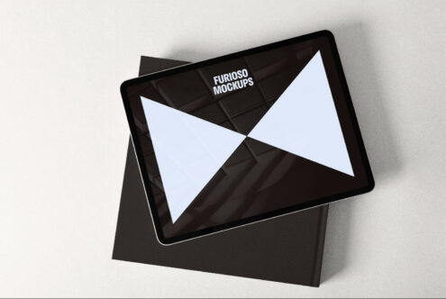 Tablet device mockup on textured paper background, professional digital presentation tool, ideal for showcasing app and web design.