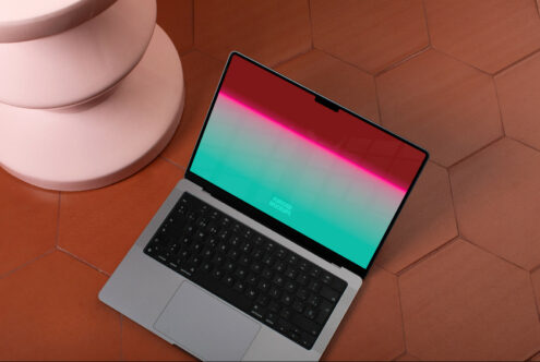 Laptop with vibrant screen mockup on terracotta tiles, ideal for presenting web and app design to clients, perfect for designers' portfolios.