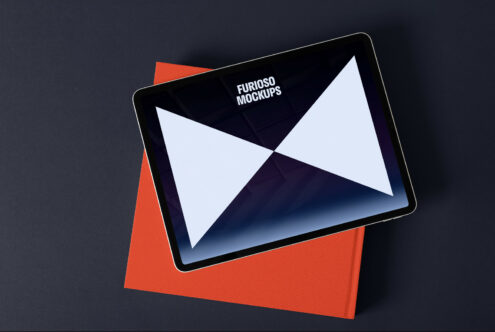 Elegant tablet mockup on a dark background with orange accent, showcasing screen design, ideal for designers and presentations.