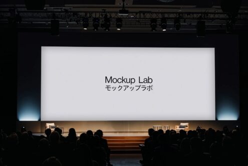 Large projection screen displaying Mockup Lab text with Japanese characters during conference presentation